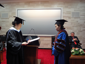 Chancellor receives her honorary doctoral degree from President Park