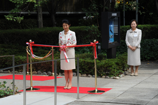 Princess Takamado performs the ceremonial ribbon cutting