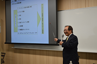 CEO Aizawa delivers his lecture to students following the press conference