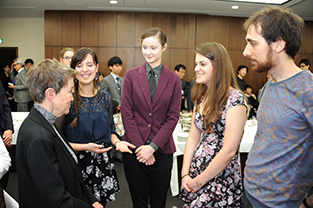 Dr. Daley speaks with study abroad students at the reception