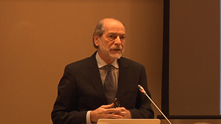 Dr. Giès speaks during the lecture