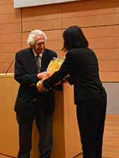Prof. Bernstein receives a bouquet from a student