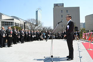 Chancellor ad interim Motoyuki Ono speaks before the ribbon-cutting event