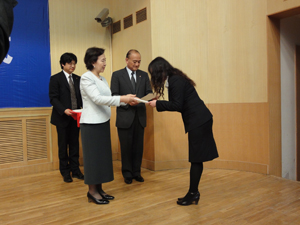 A student receives admission letter from the Chancellor