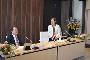 Chancellor Mizuta greets the assembly before the agreement signing