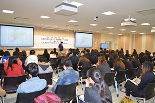 The lecture before a large audience of students