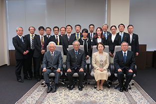 A commemorative photo with the four scholarship recipients