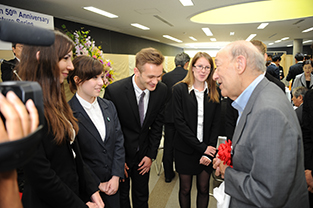 Dr. Vogel having a pleasant conversation with exchange students