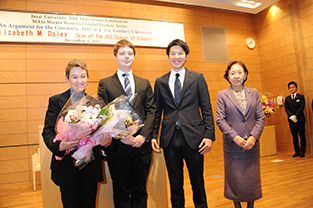 Student representatives present Dr. Daley with bouquets