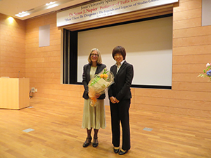 Professor Napier received a bouquet of flowers from a student